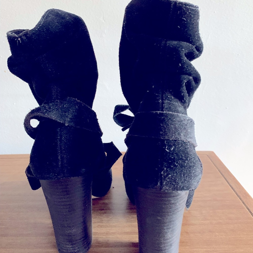 Black ankle peep toe tie boots in great condition.